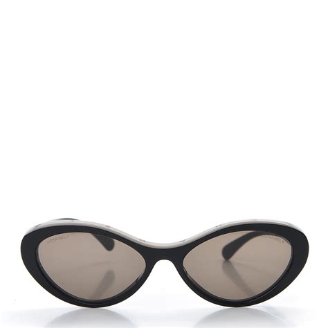 chanel black oval sunglasses.